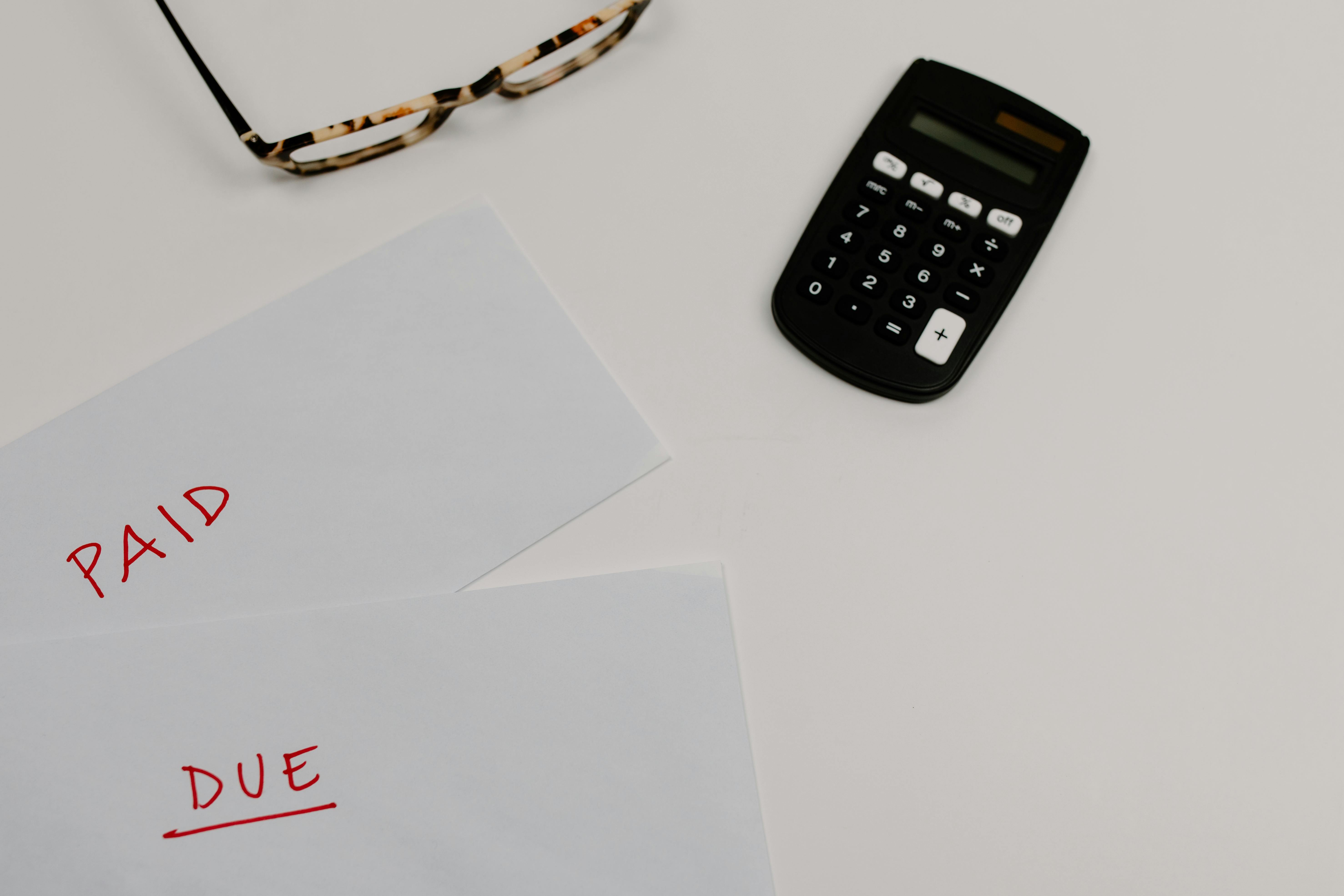 Kenyan individual reviewing multiple debts to consider consolidation.